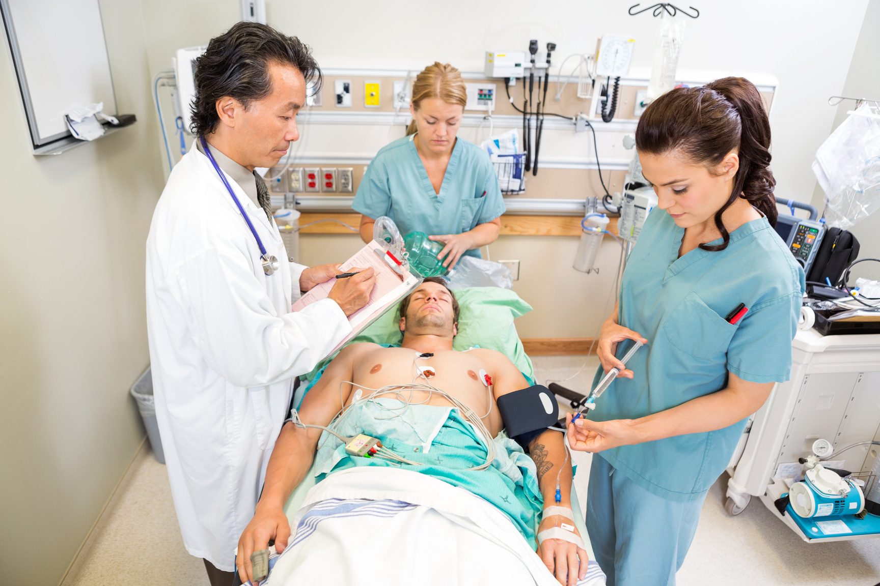 Doctor and Nurses Treating Critical Patient